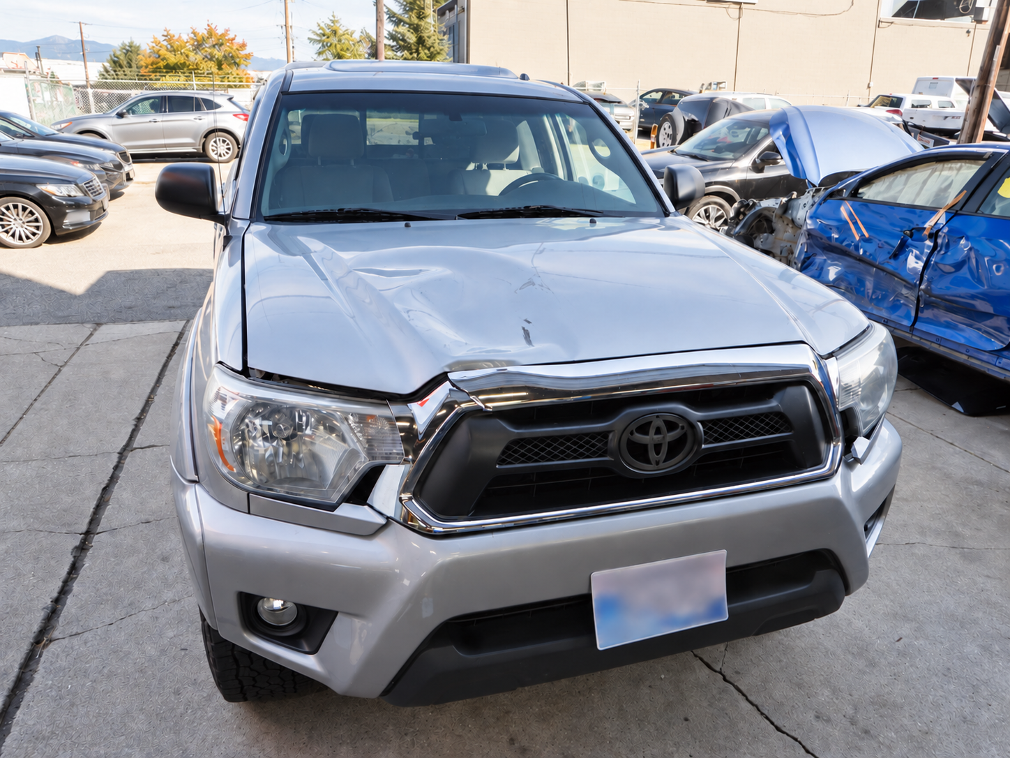 Toyota Tacoma with front-end collision damage before repair